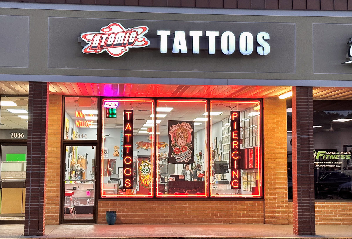 front of atomic tattoo shop with glass windows